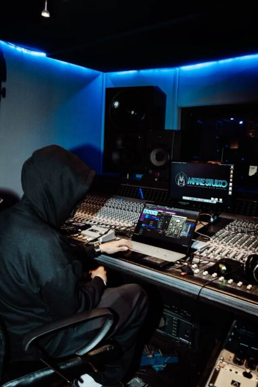 A Session musician in the studio. Understanding Splitsheets: A Guide for African Songwriters